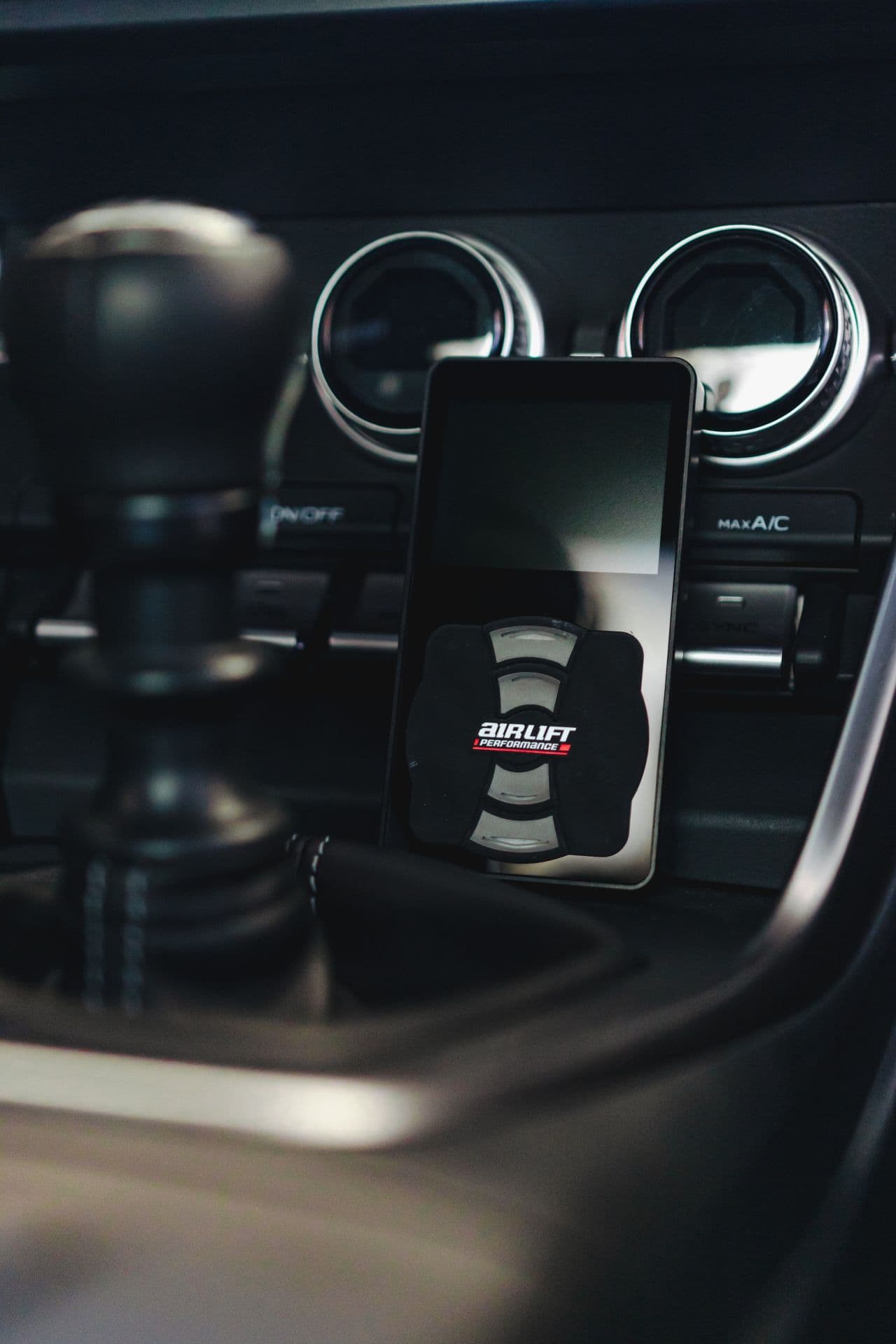 A vehicle equipped with Air Lift Performance at SEMA 2024 in Las Vegas.